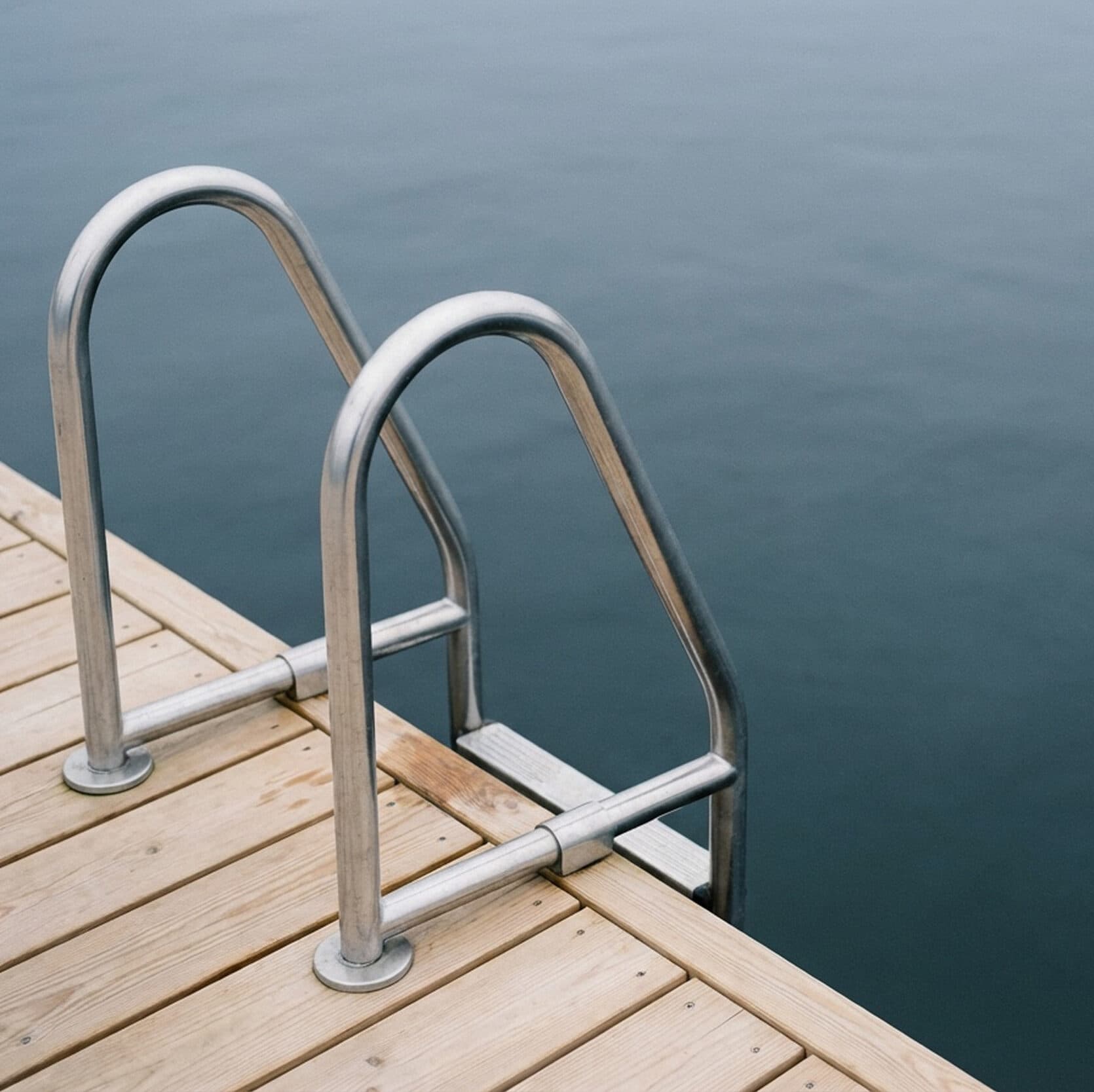 A pool ladder leading into water